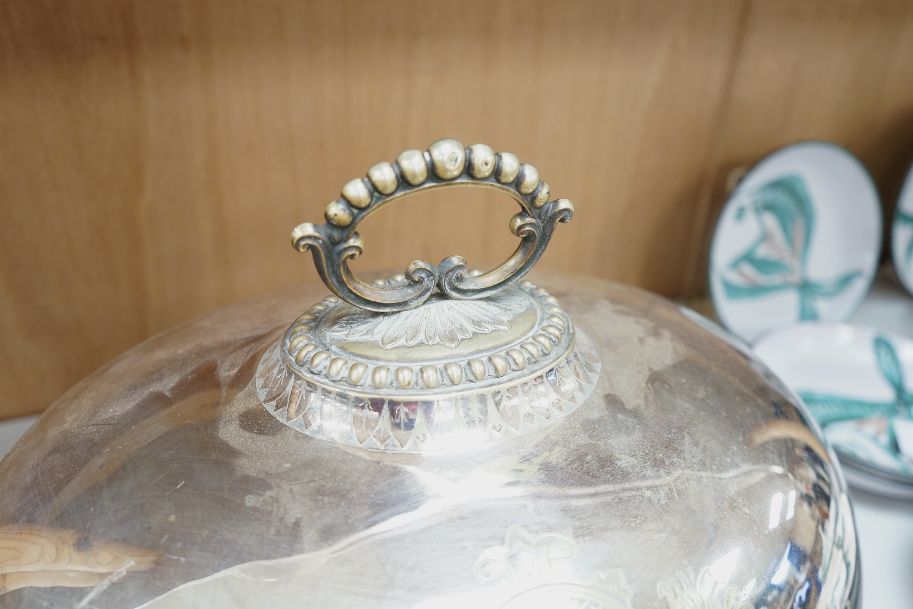 A set of three graduated Victorian silver plated meat dish covers, 51cm wide. Condition - plate in places worn